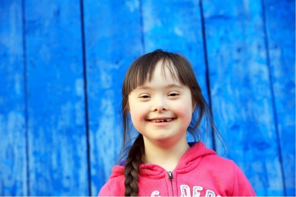 Child smiling after special needs children's dentistry visit