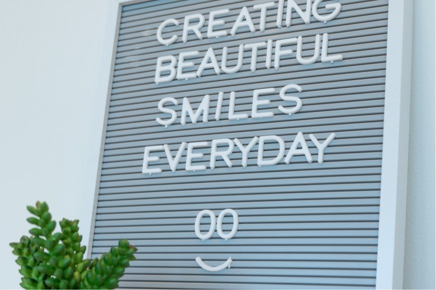 Creating beautiful smiles every day sign
