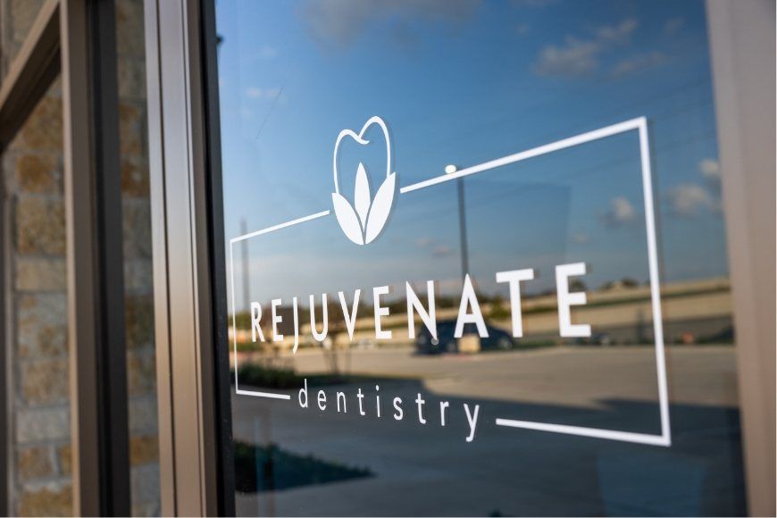 Rejuvenate Dentistry of Cinco Ranch Texas logo on dental office door
